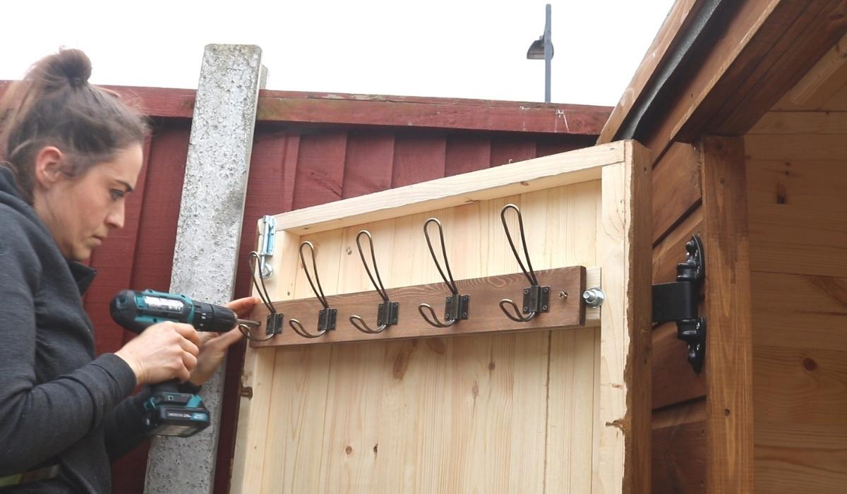A hook rail on a wooden shed