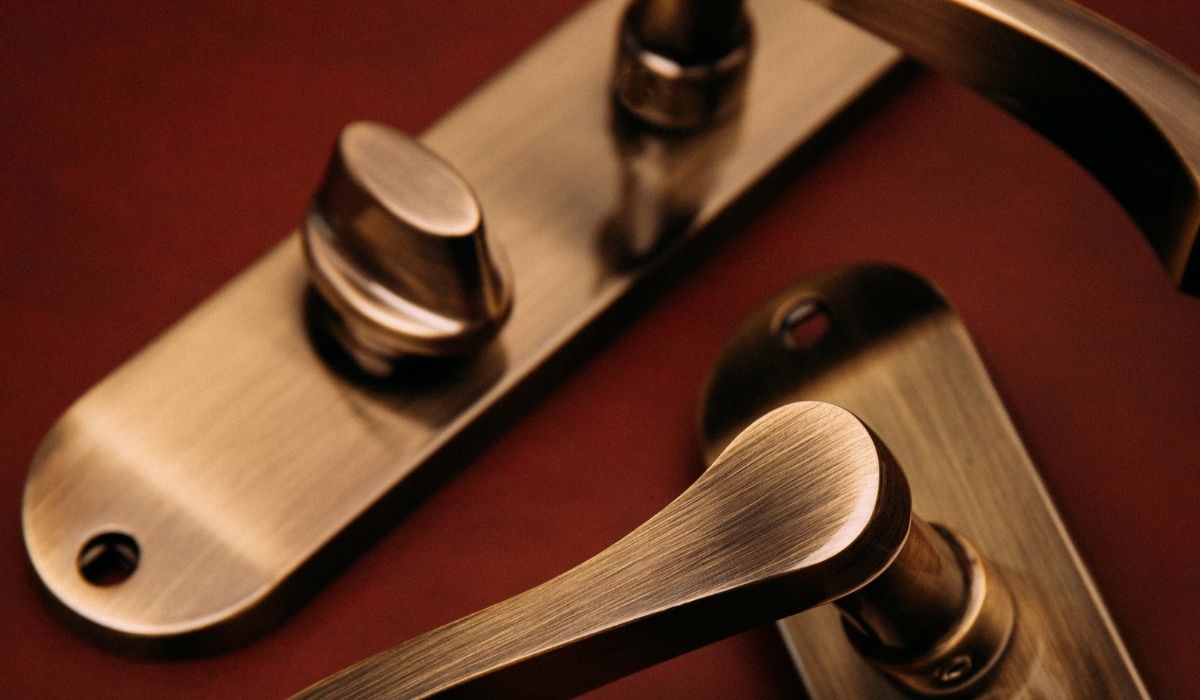 Capri Bathroom Lock Door Handles in Antique Brass